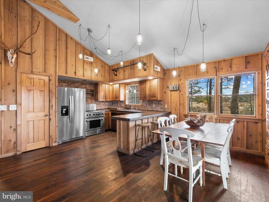 Dining room, Interior, Kitchen, Pendant Lights, Stainless Steel Appliances, Wood Texture Flooring, Wooden Walls