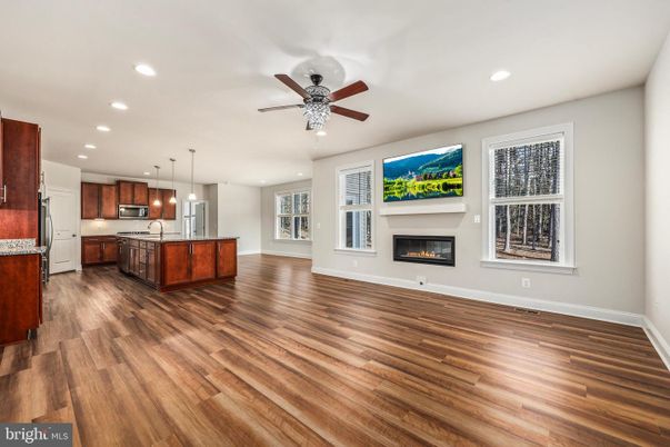 Empty room, Fireplace, Interior, Kitchen, Pendant Lights, Recessed Lighting, Wood Texture Flooring