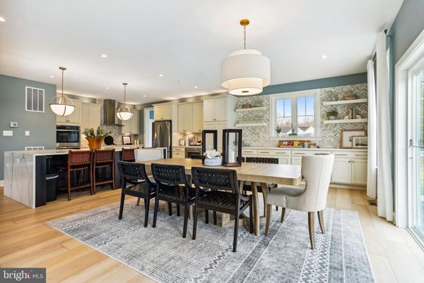 Dining room, Interior, Kitchen, Pendant Lights, Recessed Lighting, Stainless Steel Appliances, Wood Texture Flooring