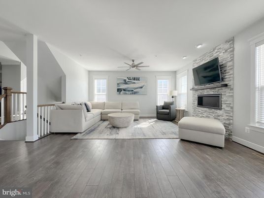 Fireplace, Interior, Living room, Recessed Lighting, Stone Walls, Wood Texture Flooring
