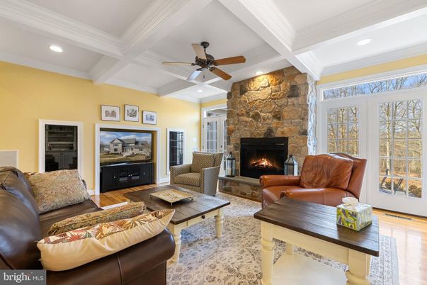 Fireplace, Interior, Living room, Recessed Lighting, Stone Walls, Wood Texture Flooring