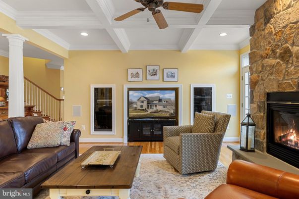 Fireplace, Interior, Living room, Recessed Lighting, Stone Walls, Wood Texture Flooring
