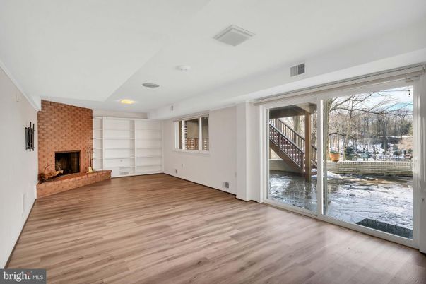Empty room, Fireplace, Interior, Recessed Lighting, Stone Walls, Wood Texture Flooring