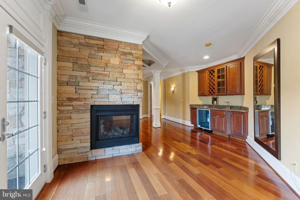 Empty room, Fireplace, Interior, Recessed Lighting, Stone Walls, Wood Texture Flooring