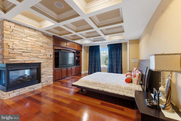 Bedroom, Fireplace, Interior, Recessed Lighting, Stone Walls, Wood Texture Flooring