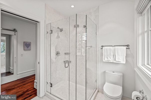 Bathroom, Glass Shower, Interior, Marble Walls, Recessed Lighting, Wood Texture Flooring