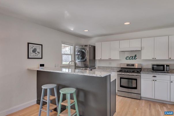 Interior, Kitchen, Recessed Lighting, Stainless Steel Appliances, Washer, Wood Texture Flooring