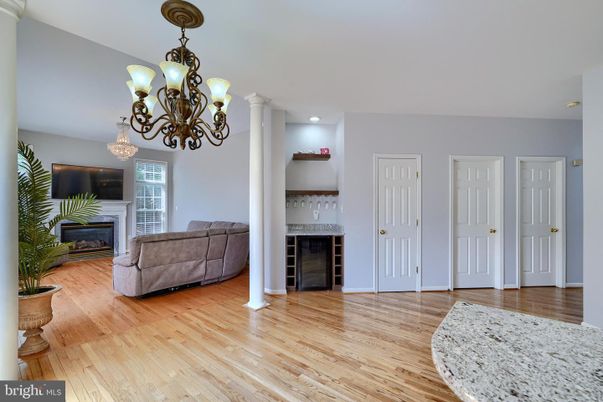 Chandelier, Fireplace, Interior, Living room, Recessed Lighting, Wood Texture Flooring