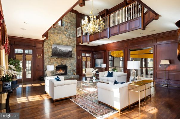 Chandelier, Fireplace, Interior, Living room, Recessed Lighting, Stone Walls, Wood Texture Flooring, Wooden Walls