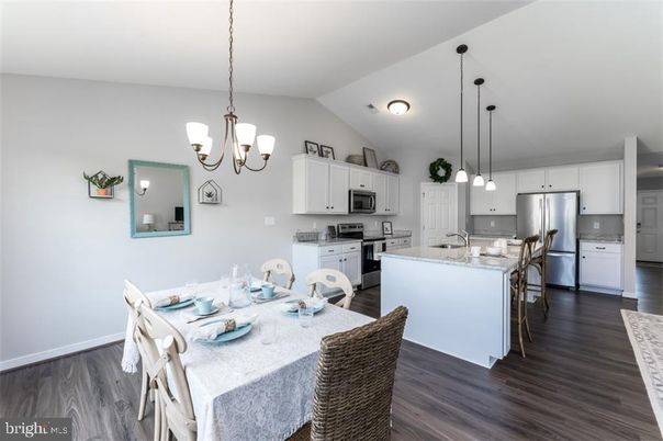 Chandelier, Dining room, Interior, Kitchen, Pendant Lights, Stainless Steel Appliances, Wood Texture Flooring