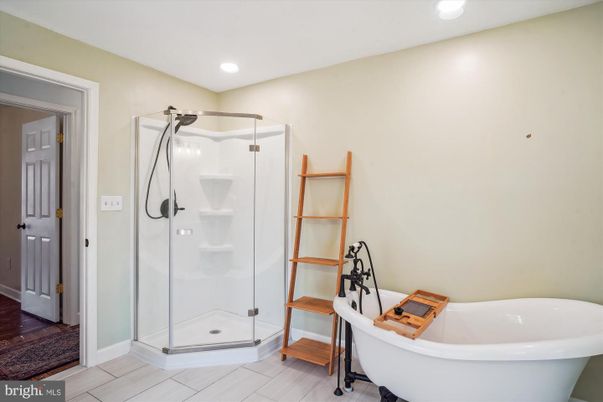 Bathroom, Free Standing Baths, Glass Shower, Interior, Recessed Lighting, Wood Texture Flooring