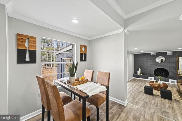 Dining room, Fireplace, Interior, Recessed Lighting, Stone Walls, Wood Texture Flooring