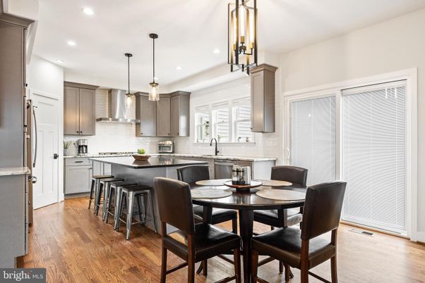 Dining room, Interior, Kitchen, Pendant Lights, Recessed Lighting, Stainless Steel Appliances, Wood Texture Flooring