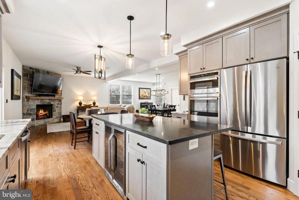 Dining room, Fireplace, Interior, Kitchen, Living room, Pendant Lights, Recessed Lighting, Stainless Steel Appliances, Wood Texture Flooring