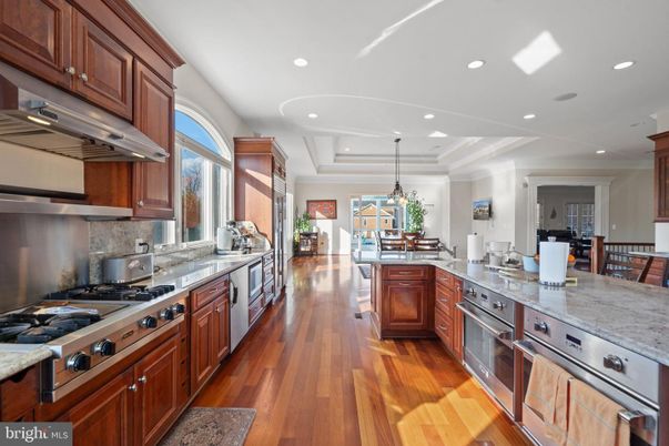 Chandelier, Dining room, Interior, Kitchen, Pendant Lights, Recessed Lighting, Stainless Steel Appliances, Wood Texture Flooring