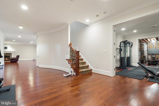 Fireplace, Fitness Equipment, Interior, Recessed Lighting, Wood Texture Flooring