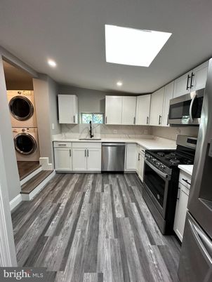 Interior, Kitchen, Recessed Lighting, Stainless Steel Appliances, Washer, Wood Texture Flooring