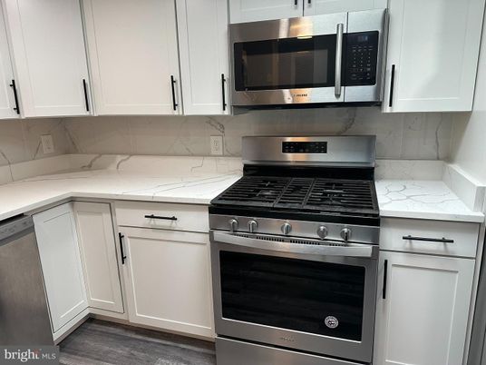Interior, Kitchen, Marble Walls, Stainless Steel Appliances, Wood Texture Flooring