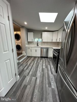 Interior, Kitchen, Recessed Lighting, Stainless Steel Appliances, Washer, Wood Texture Flooring