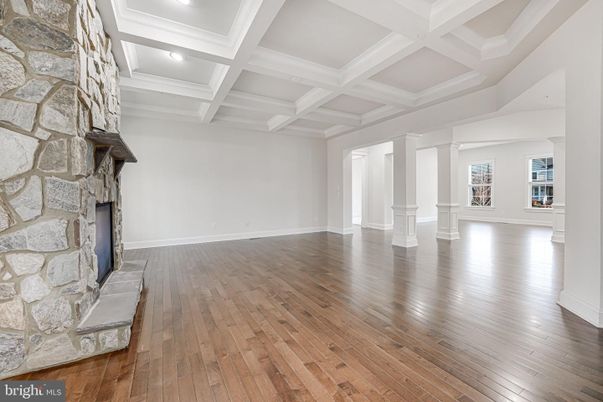 Empty room, Fireplace, Interior, Recessed Lighting, Stone Walls, Wood Texture Flooring