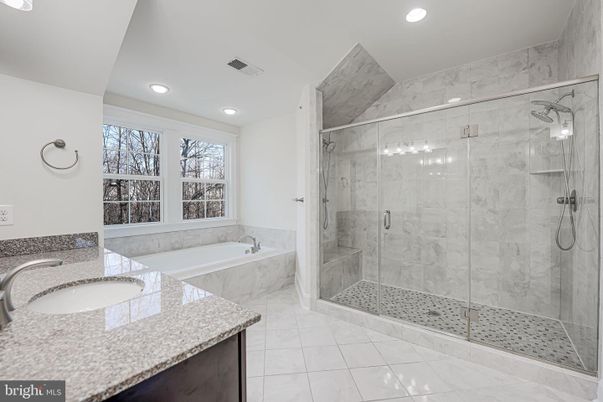 Bathroom, Dual Sink Vanities, Glass Shower, Interior, Marble Walls, Recessed Lighting