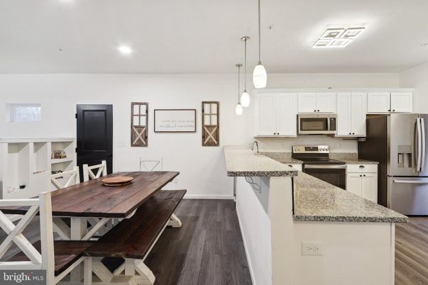 Dining room, Interior, Kitchen, Pendant Lights, Recessed Lighting, Stainless Steel Appliances, Wood Texture Flooring