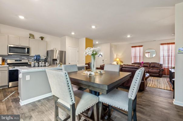 Dining room, Interior, Kitchen, Living room, Recessed Lighting, Stainless Steel Appliances, Wood Texture Flooring