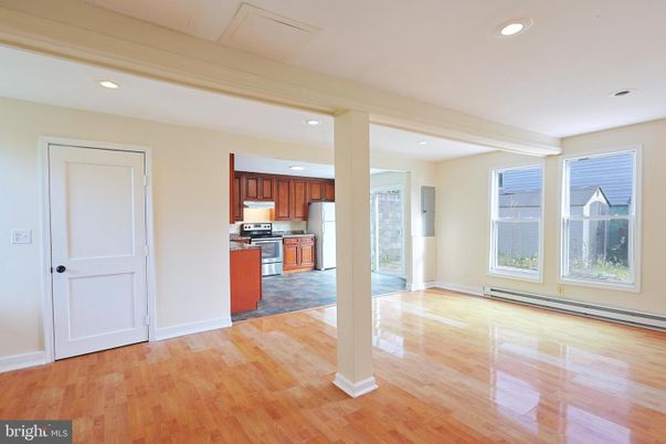 Empty room, Interior, Kitchen, Recessed Lighting, Stainless Steel Appliances, Wood Texture Flooring