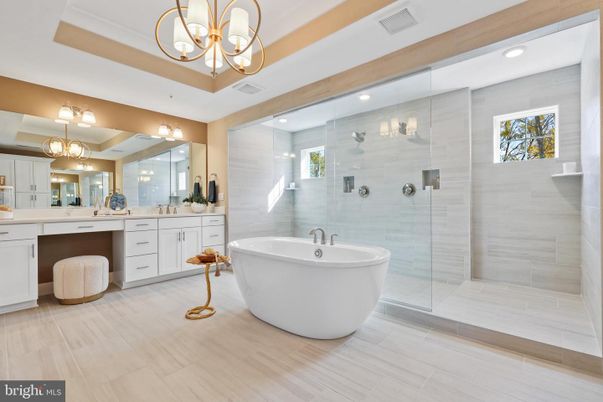 Bathroom, Chandelier, Dual Sink Vanities, Free Standing Baths, Glass Shower, Interior, Recessed Lighting, Wood Texture Flooring