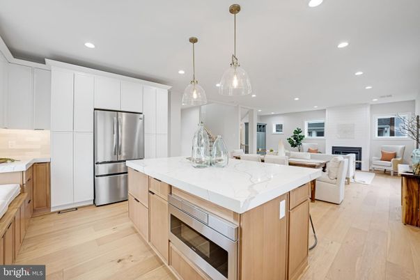 Dining room, Fireplace, Interior, Kitchen, Living room, Pendant Lights, Recessed Lighting, Stainless Steel Appliances, Wood Texture Flooring