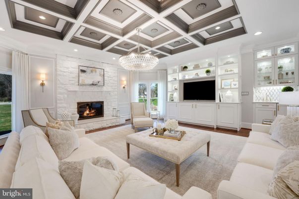 Chandelier, Fireplace, Interior, Living room, Recessed Lighting, Stone Walls, Wood Texture Flooring