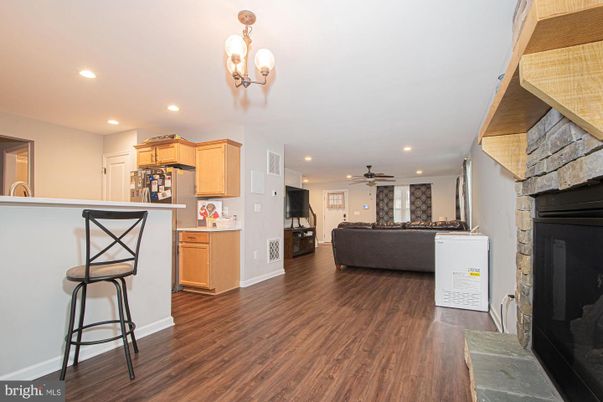 Fireplace, Interior, Kitchen, Living room, Recessed Lighting, Stone Walls, Wood Texture Flooring