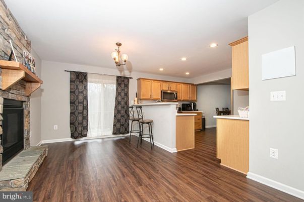Fireplace, Interior, Kitchen, Recessed Lighting, Stainless Steel Appliances, Wood Texture Flooring