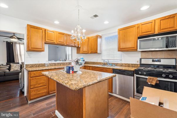 Chandelier, Interior, Kitchen, Pendant Lights, Recessed Lighting, Stainless Steel Appliances, Wood Texture Flooring