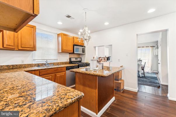 Chandelier, Interior, Kitchen, Pendant Lights, Recessed Lighting, Stainless Steel Appliances, Wood Texture Flooring