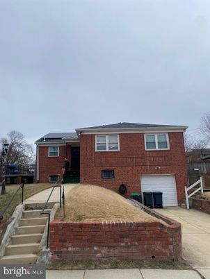 Attached, Exterior, Facade, Brick Facade, Solar Panels, Raised Ranch