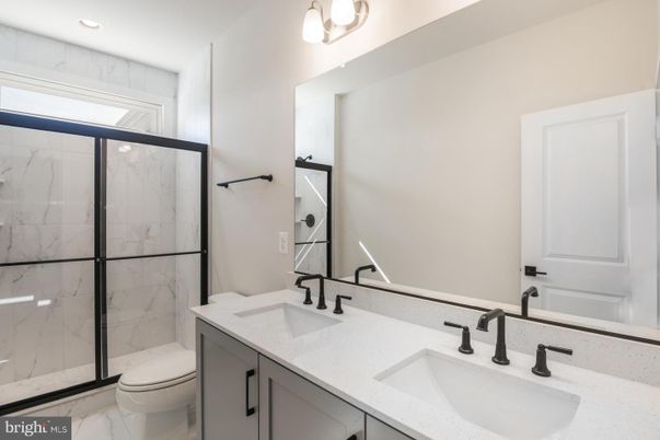 Bathroom, Dual Sink Vanities, Glass Shower, Interior, Marble, Marble Walls, Recessed Lighting