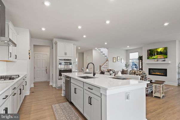 Fireplace, Interior, Kitchen, Living room, Recessed Lighting, Stainless Steel Appliances, Wood Texture Flooring