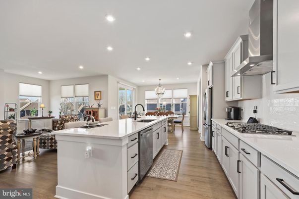Chandelier, Dining room, Interior, Kitchen, Recessed Lighting, Stainless Steel Appliances, Wood Texture Flooring