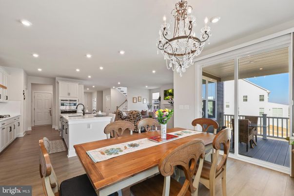 Chandelier, Dining room, Interior, Kitchen, Recessed Lighting, Stainless Steel Appliances, Wood Texture Flooring