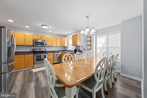 Chandelier, Dining room, Interior, Kitchen, Pendant Lights, Recessed Lighting, Stainless Steel Appliances, Wood Texture Flooring