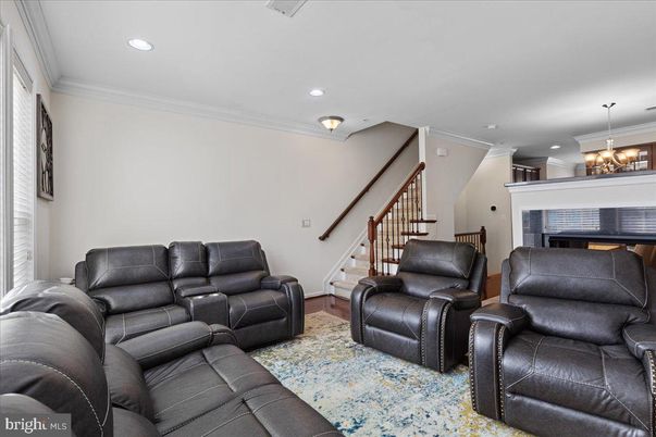 Chandelier, Fireplace, Interior, Living room, Recessed Lighting, Wood Texture Flooring