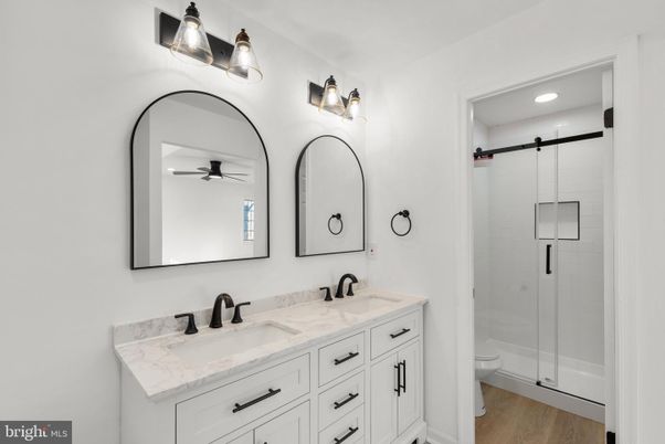 Bathroom, Dual Sink Vanities, Glass Shower, Interior, Recessed Lighting, Wood Texture Flooring