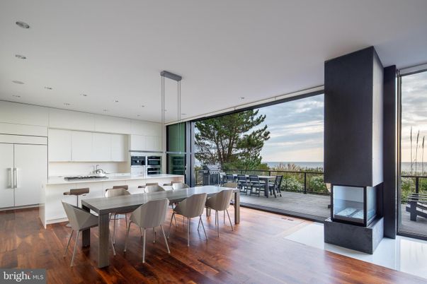Dining room, Fireplace, Interior, Kitchen, Pendant Lights, Recessed Lighting, Stainless Steel Appliances, Wood Texture Flooring
