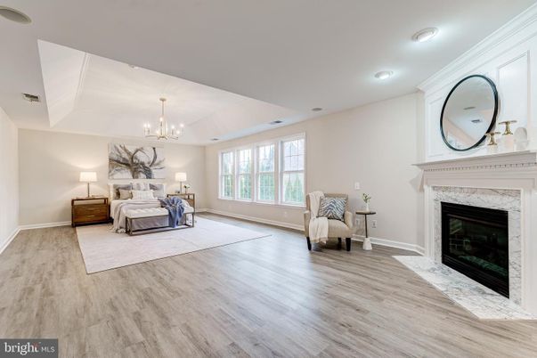 Bedroom, Chandelier, Fireplace, Interior, Recessed Lighting, Wood Texture Flooring
