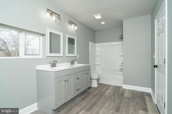 Bathroom, Dual Sink Vanities, Interior, Recessed Lighting, Wood Texture Flooring