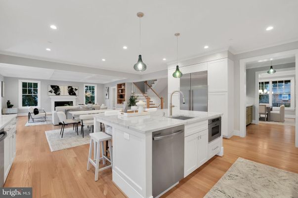 Dining room, Fireplace, Interior, Kitchen, Living room, Pendant Lights, Recessed Lighting, Stainless Steel Appliances, Wood Texture Flooring