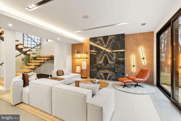 Fireplace, Interior, Living room, Marble Walls, Recessed Lighting, Wood Texture Flooring