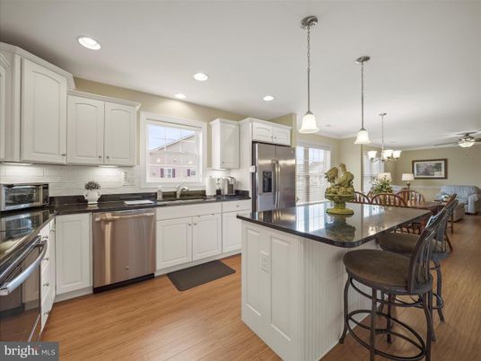 Dining room, Interior, Kitchen, Pendant Lights, Recessed Lighting, Stainless Steel Appliances, Wood Texture Flooring