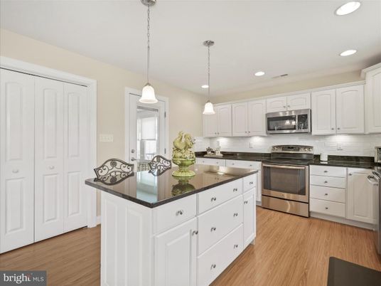 Interior, Kitchen, Pendant Lights, Recessed Lighting, Stainless Steel Appliances, Wood Texture Flooring